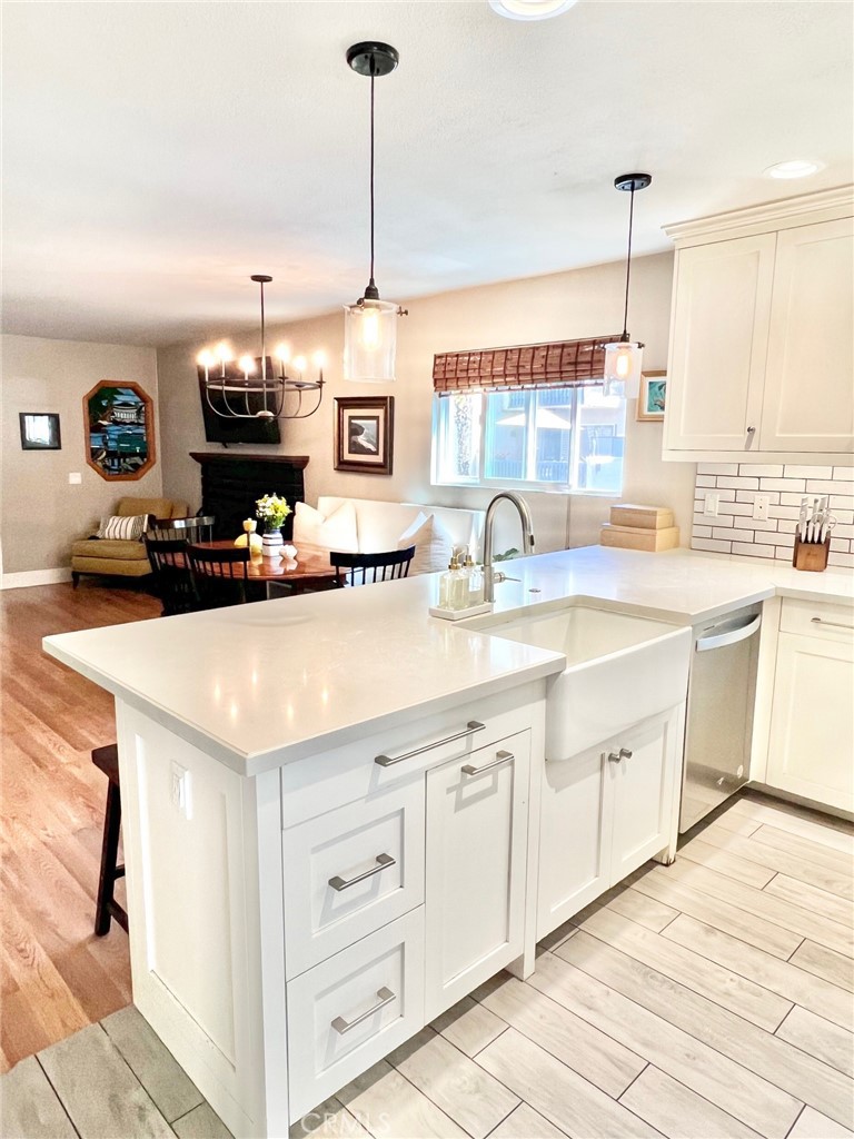 82 Canyon Terrace Road Avalon, CA 90704 - Photo 15 of 23 a kitchen with kitchen island granite countertop a sink a counter top space appliances and cabinets