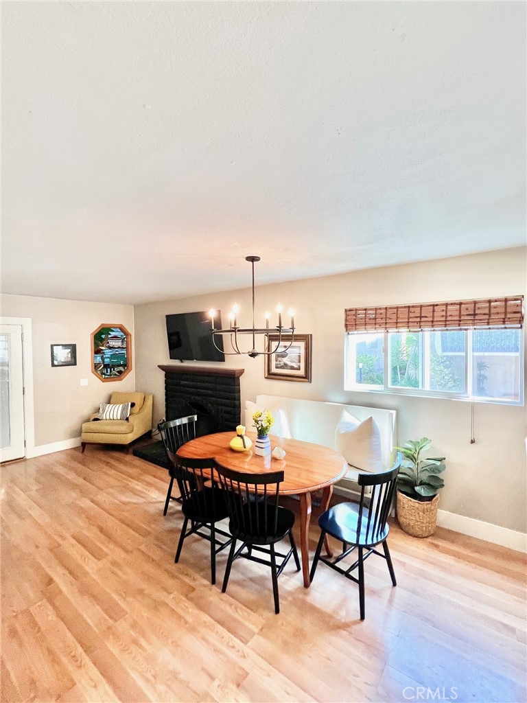 82 Canyon Terrace Road Avalon, CA 90704 - Photo 17 of 23 a view of a dining room with furniture and wooden floor