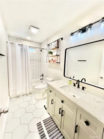 a bathroom with a sink a mirror and a shower