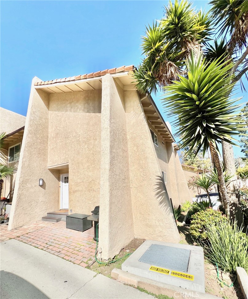 82 Canyon Terrace Road Avalon, CA 90704 - Photo 5 of 23 a view of a house with a palm tree