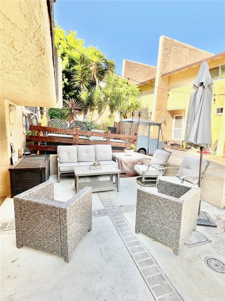 82 Canyon Terrace Road Avalon, CA 90704 - Photo 6 of 23 a living room with couches and potted plants