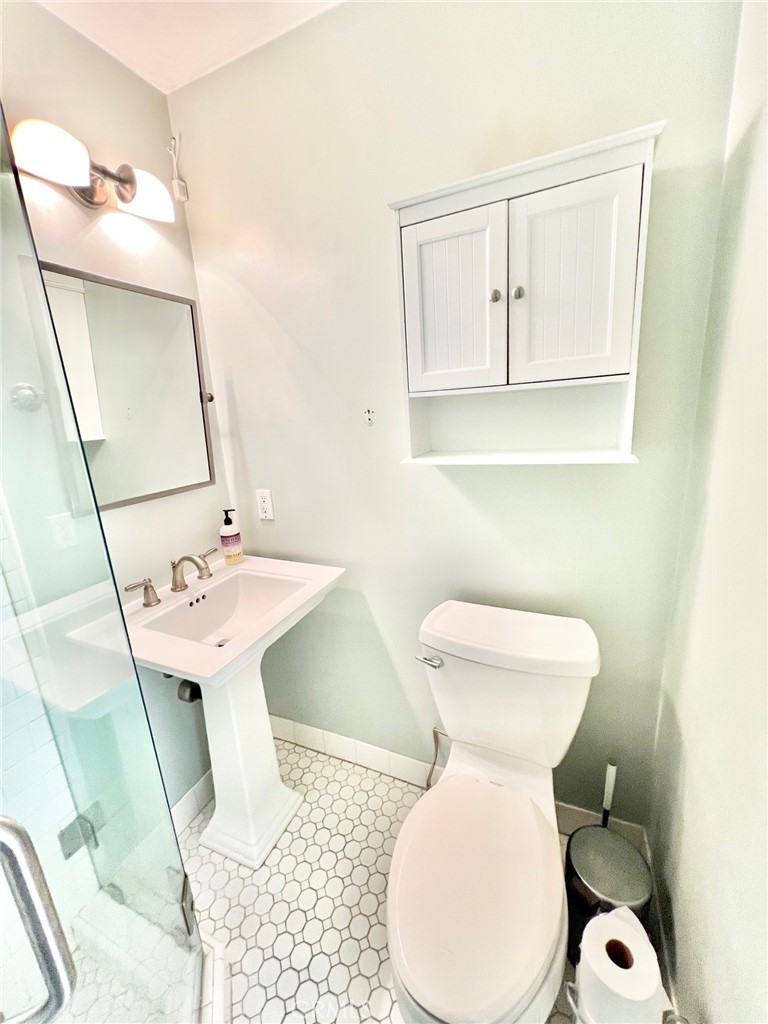 82 Canyon Terrace Road Avalon, CA 90704 - Photo 7 of 23 a bathroom with a sink toilet and mirror