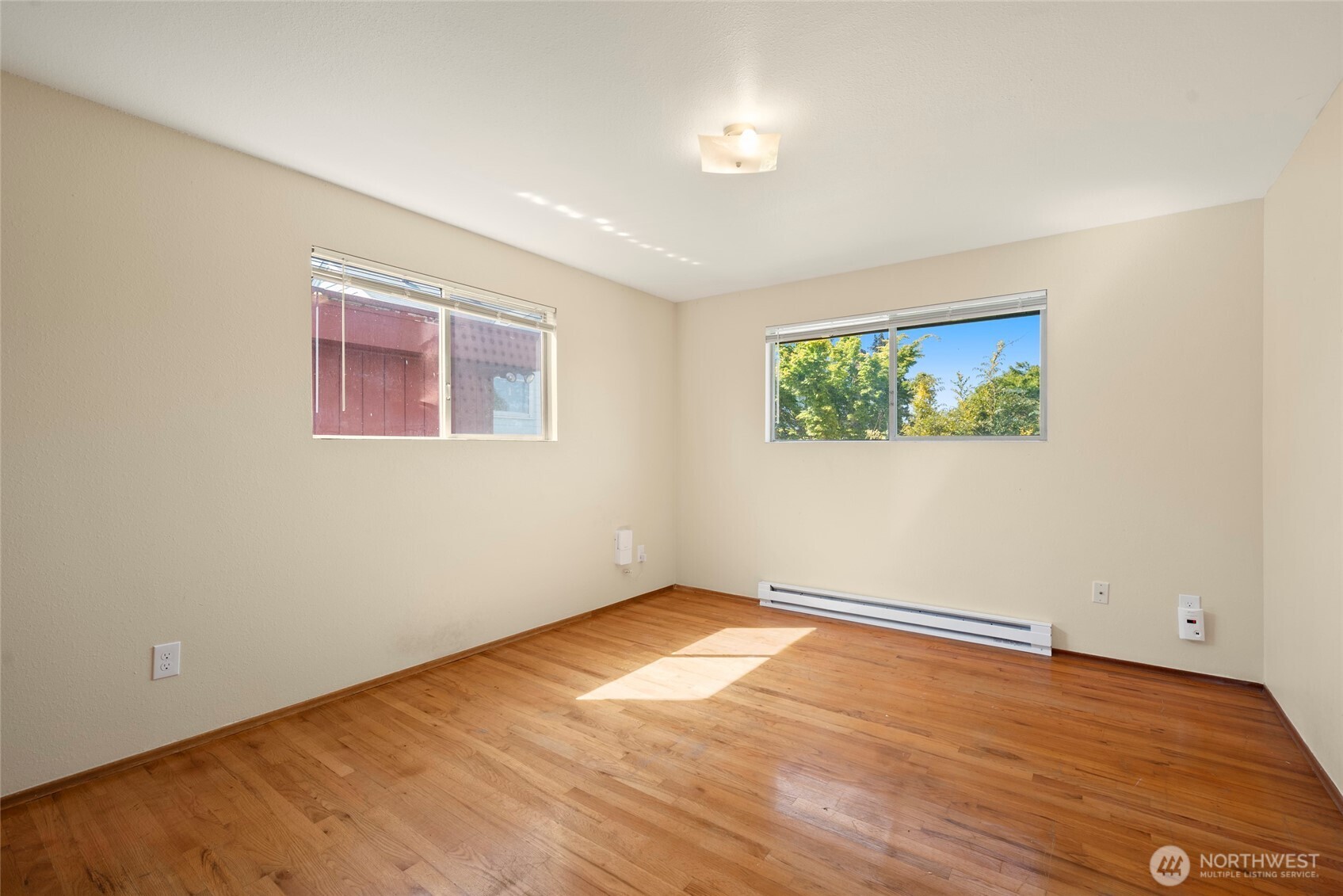 3610 Oakes Avenue Everett, WA 98201 - Photo 12 of 37 an empty room with wooden floor and window