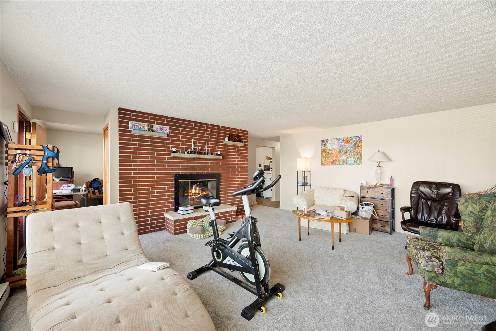 3610 Oakes Avenue Everett, WA 98201 - Photo 21 of 37 a living room with furniture a flat screen tv and a fireplace