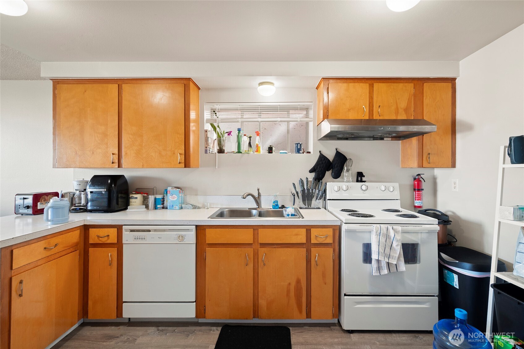 3610 Oakes Avenue Everett, WA 98201 - Photo 22 of 37 a kitchen with a stove and cabinets