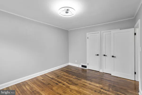 a view of room with wooden floor