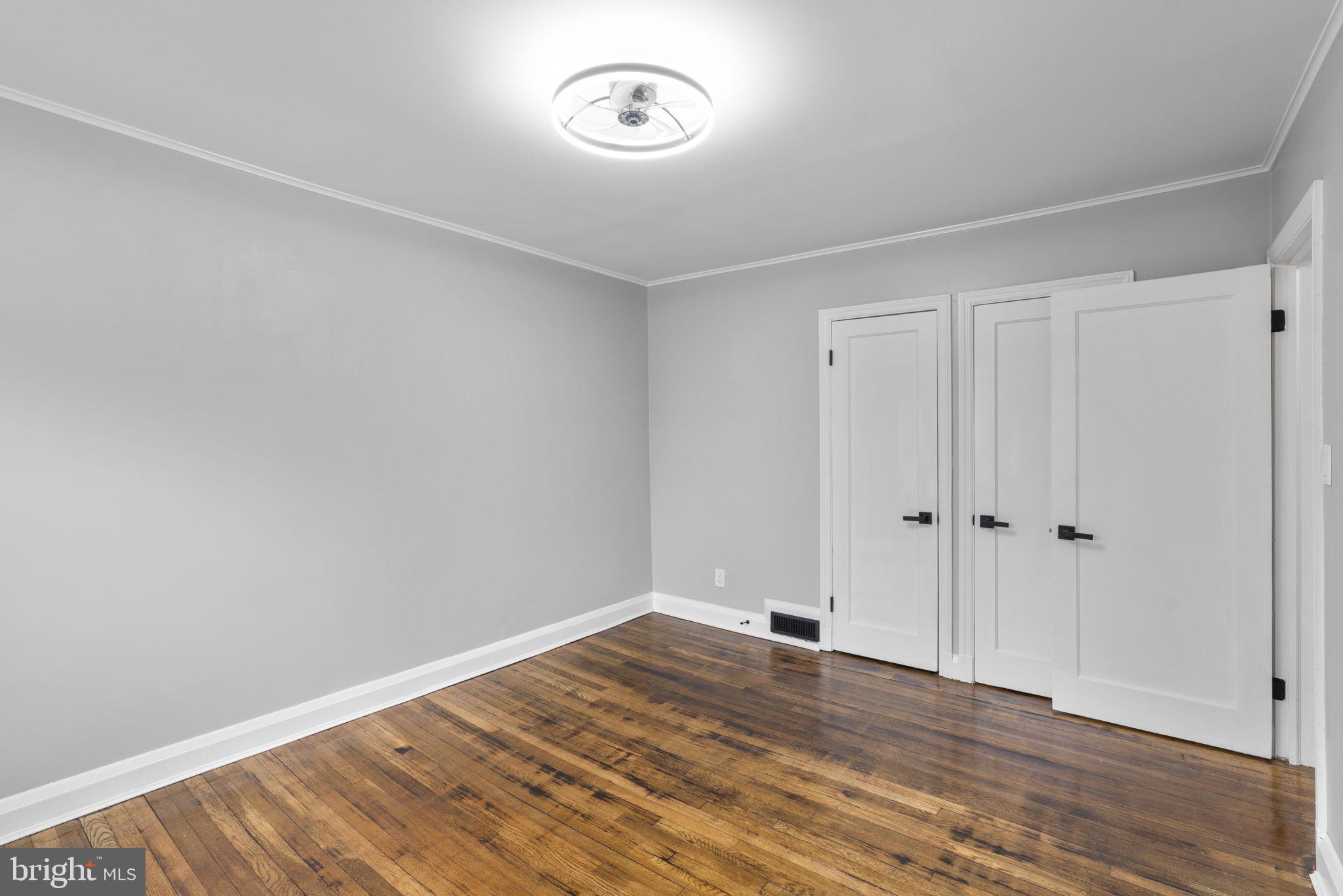 1607 Stonewood Road Baltimore, MD 21239 - Photo 19 of 53 a view of room with wooden floor