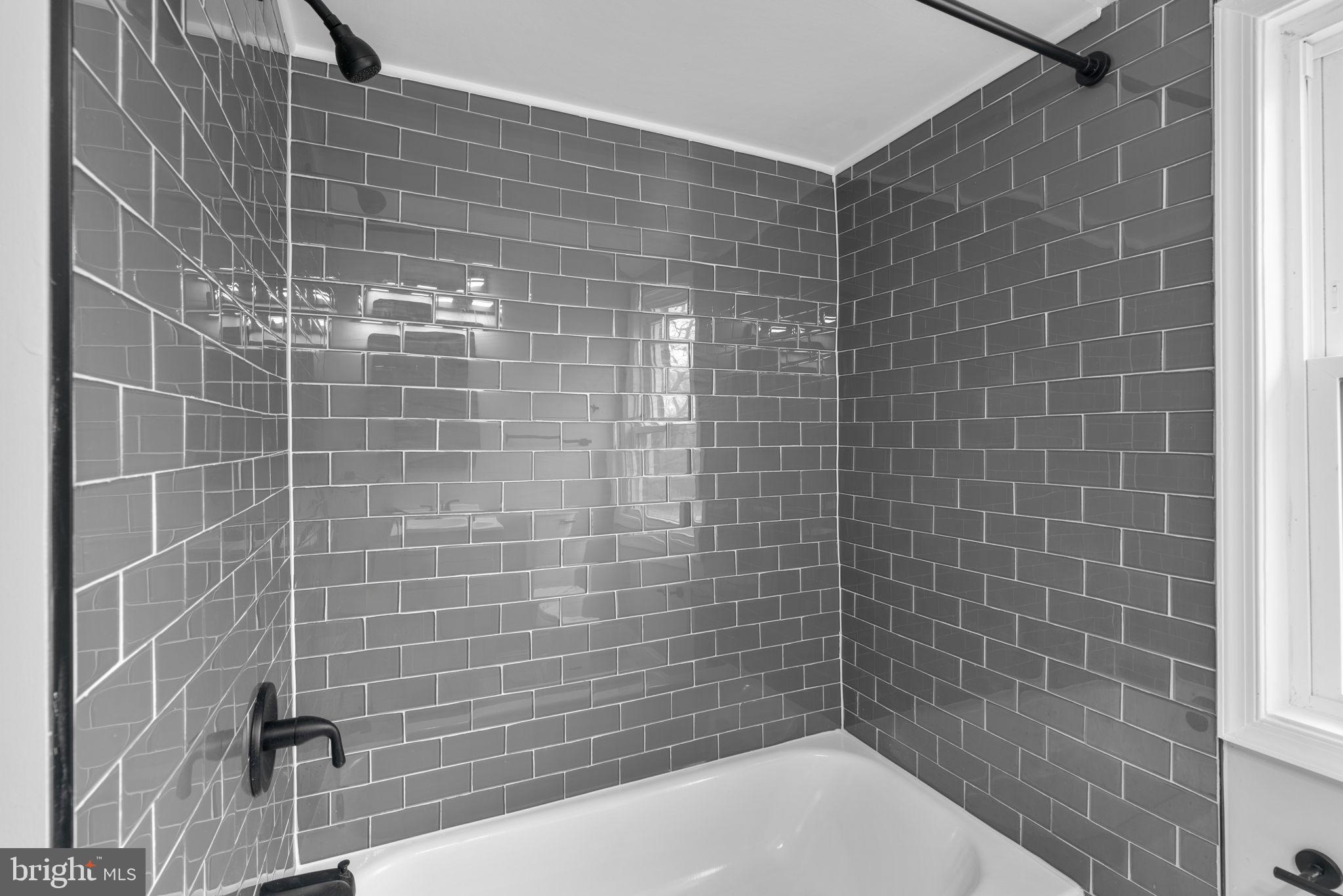 1607 Stonewood Road Baltimore, MD 21239 - Photo 29 of 53 a bathroom with a shower