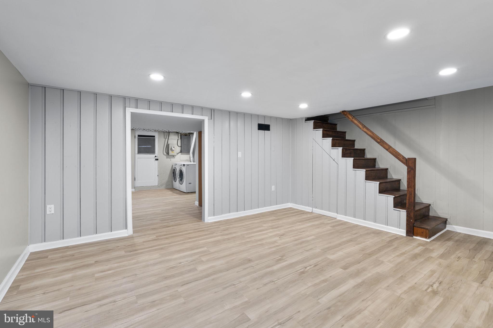 1607 Stonewood Road Baltimore, MD 21239 - Photo 34 of 53 a view of empty room with wooden floor