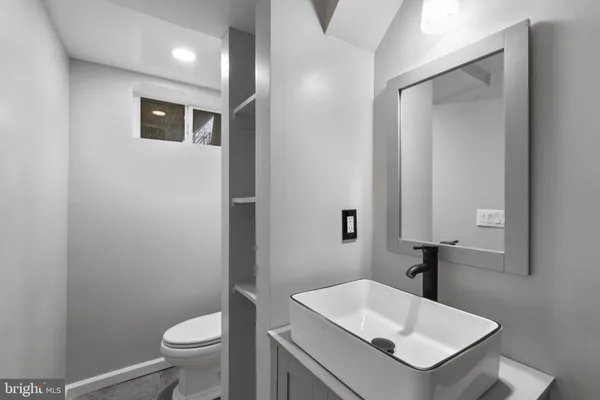 a bathroom with a shower and a sink