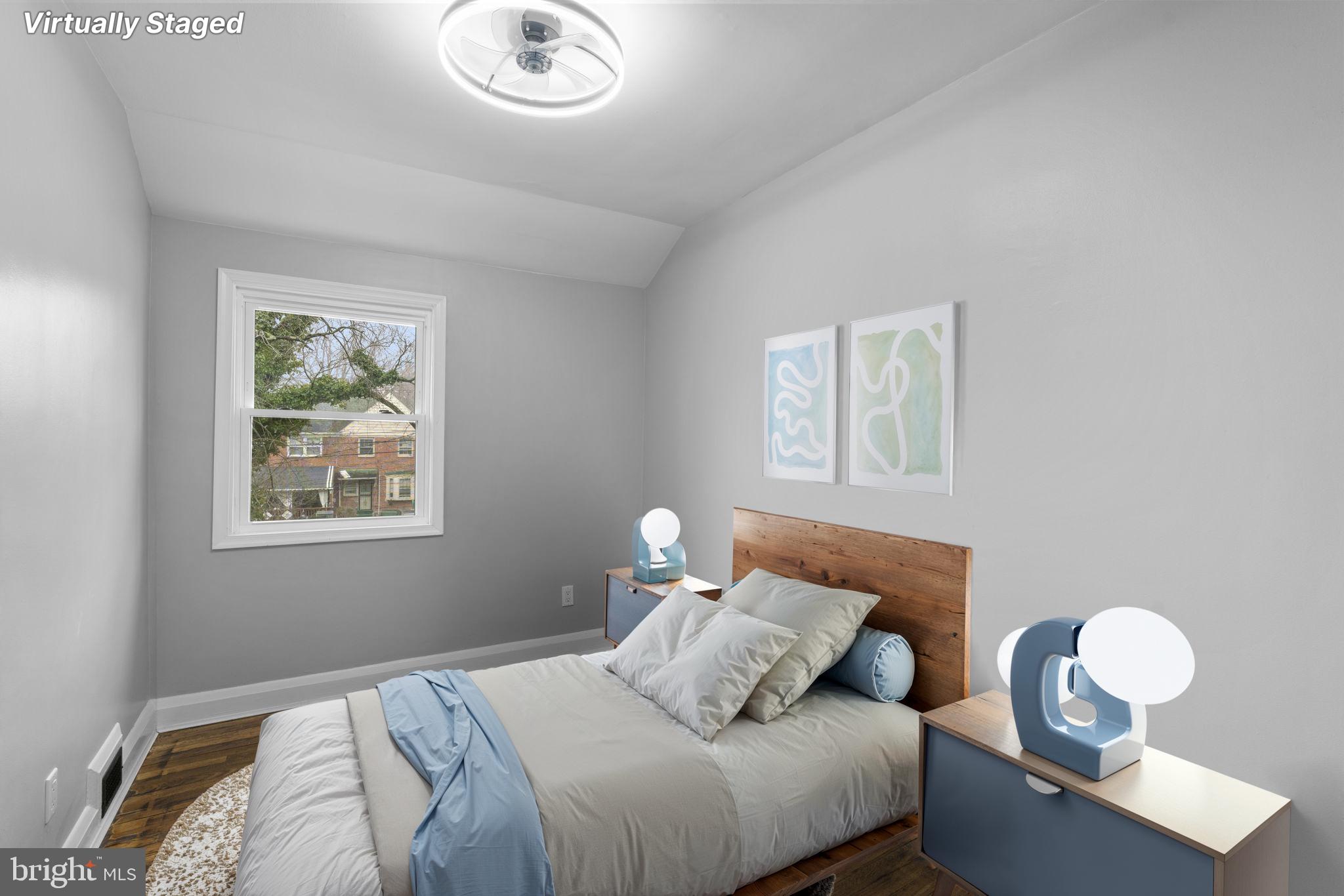 1607 Stonewood Road Baltimore, MD 21239 - Photo 47 of 53 a bedroom with bed and a window