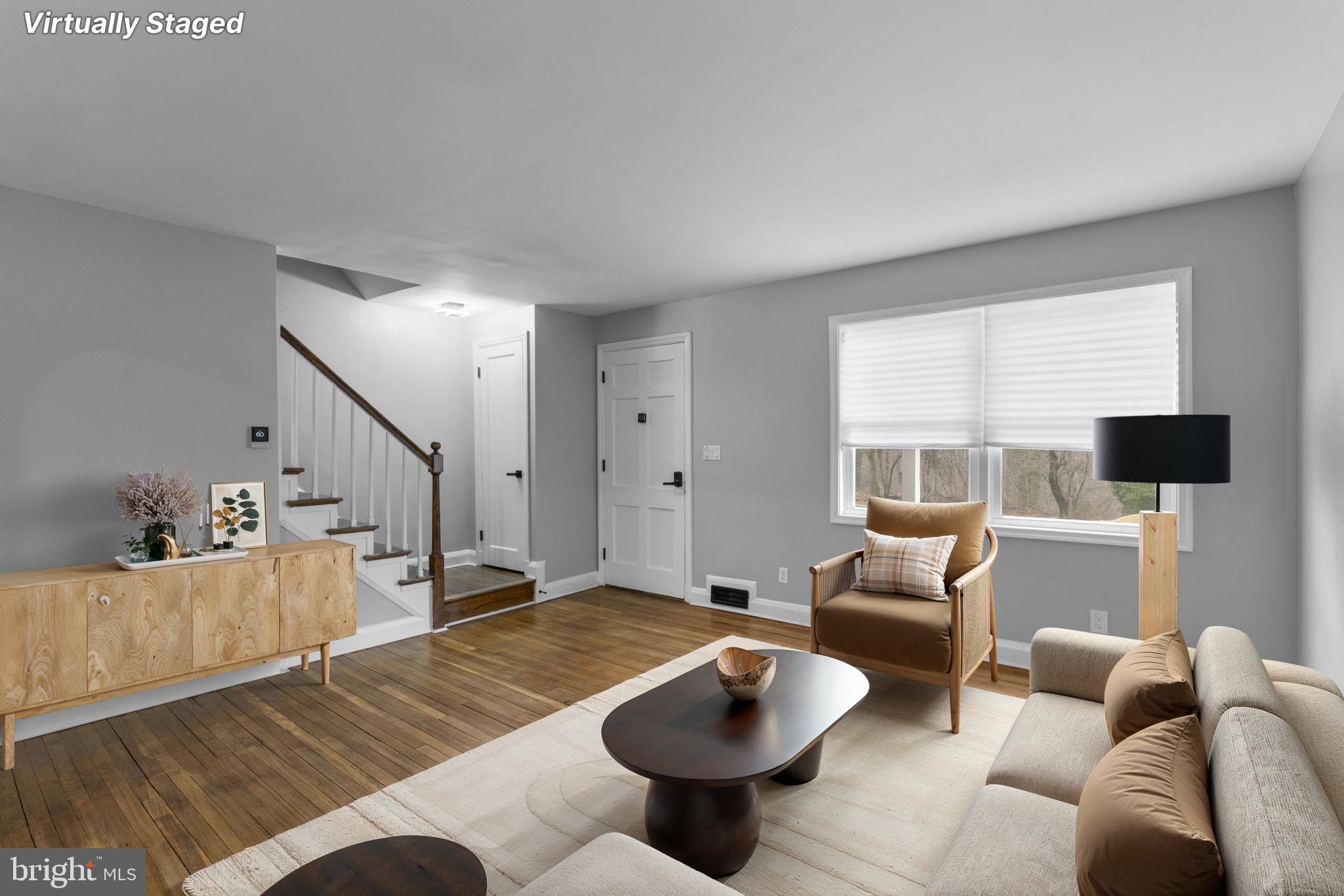 1607 Stonewood Road Baltimore, MD 21239 - Photo 51 of 53 a living room with furniture and a flat screen tv