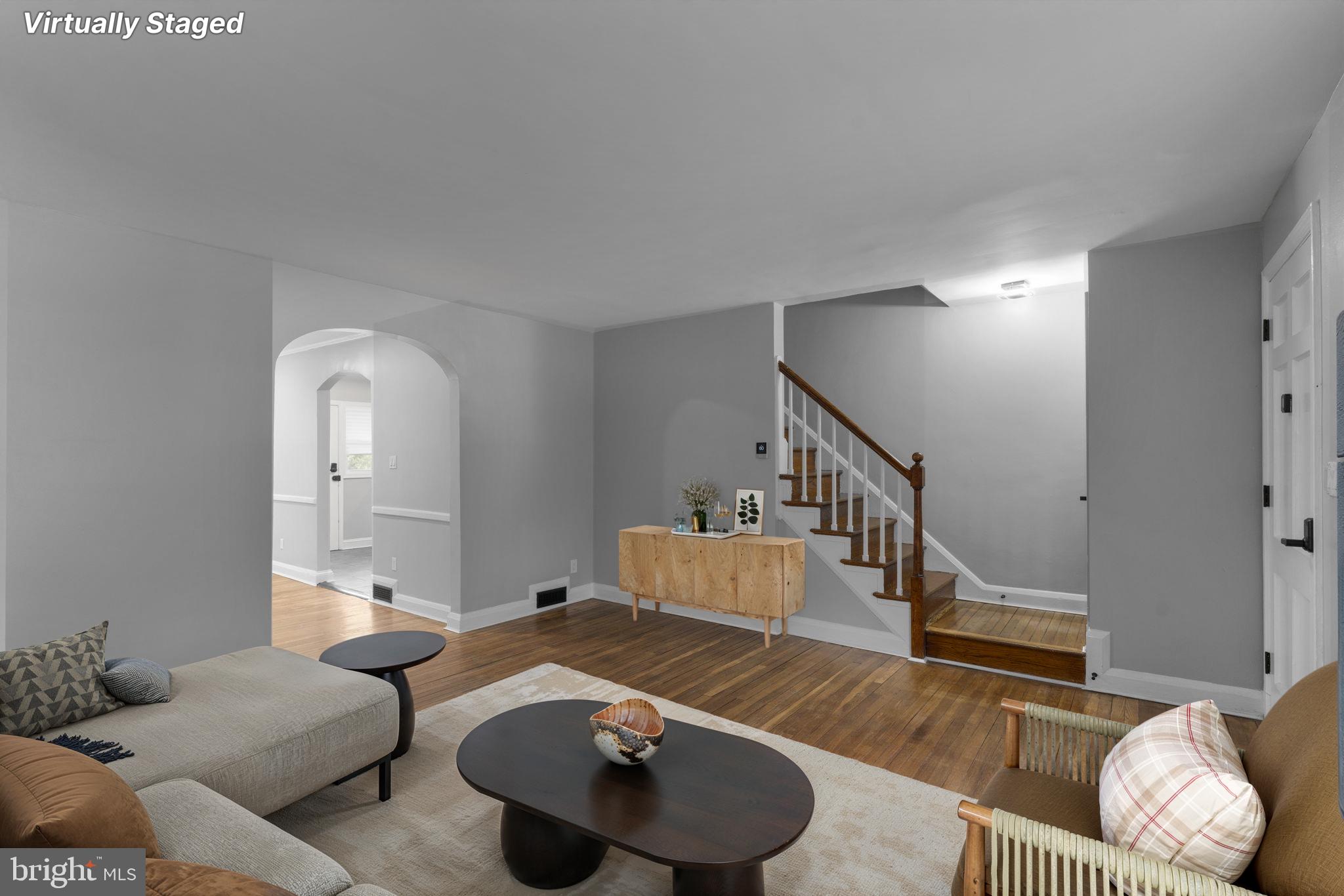 1607 Stonewood Road Baltimore, MD 21239 - Photo 52 of 53 a living room with furniture and a wooden floor