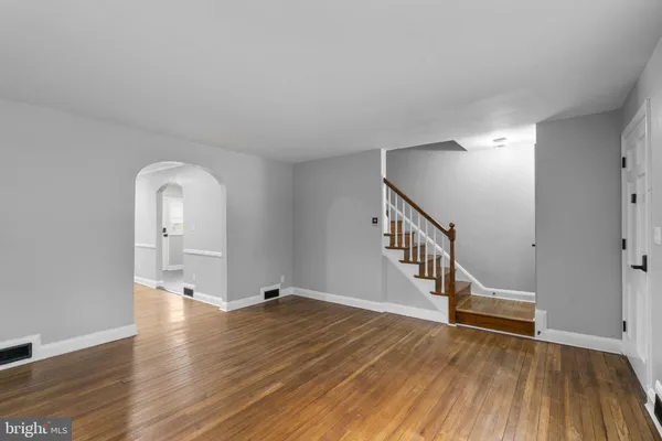 a view of an entryway with wooden floor