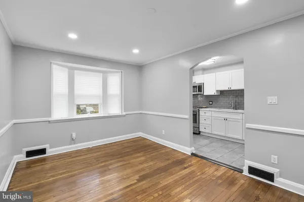 a view of a kitchen with a sink and dishwasher wooden floor