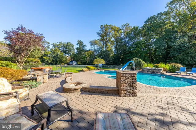 a view of an entryway with wooden floor and a rug