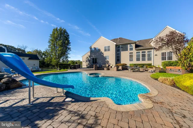 a living room with furniture ceiling fan and a fireplace
