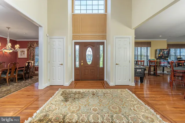 a bathroom with a sink a toilet a mirror a vanity and shower