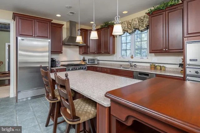 a utility room with lots of clutter and cabinets