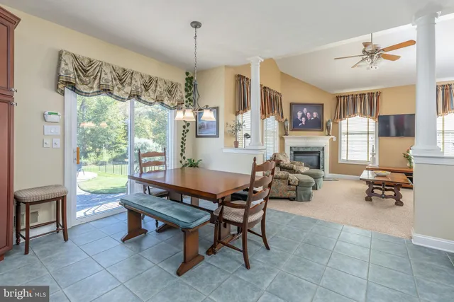 a living room with a bed furniture and a window