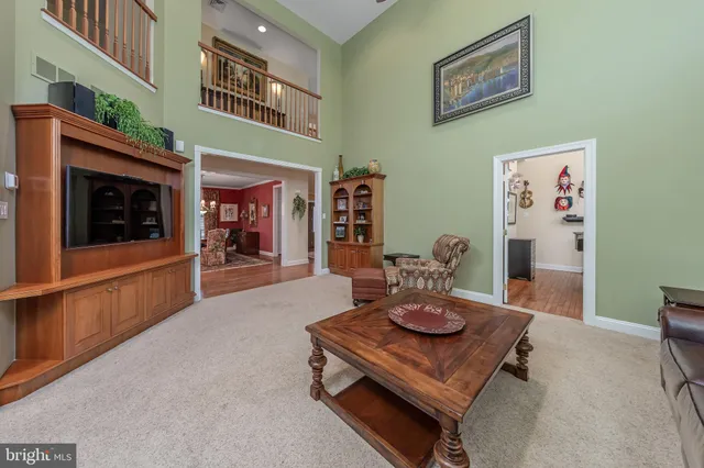 a dining room with furniture and a wooden floor