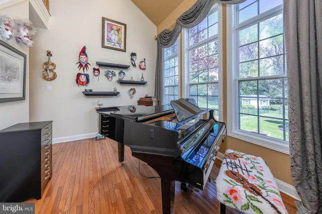a living room with furniture a projector and a flat screen tv