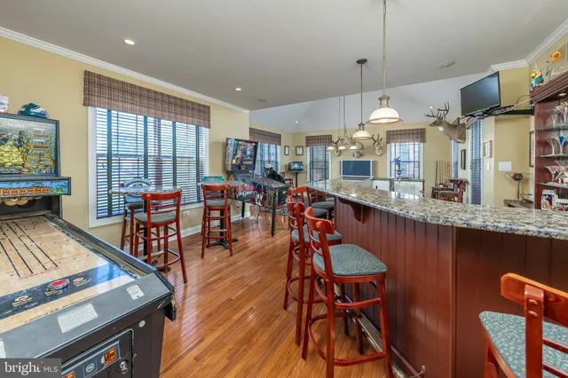 a room with gym equipment and a flat screen tv
