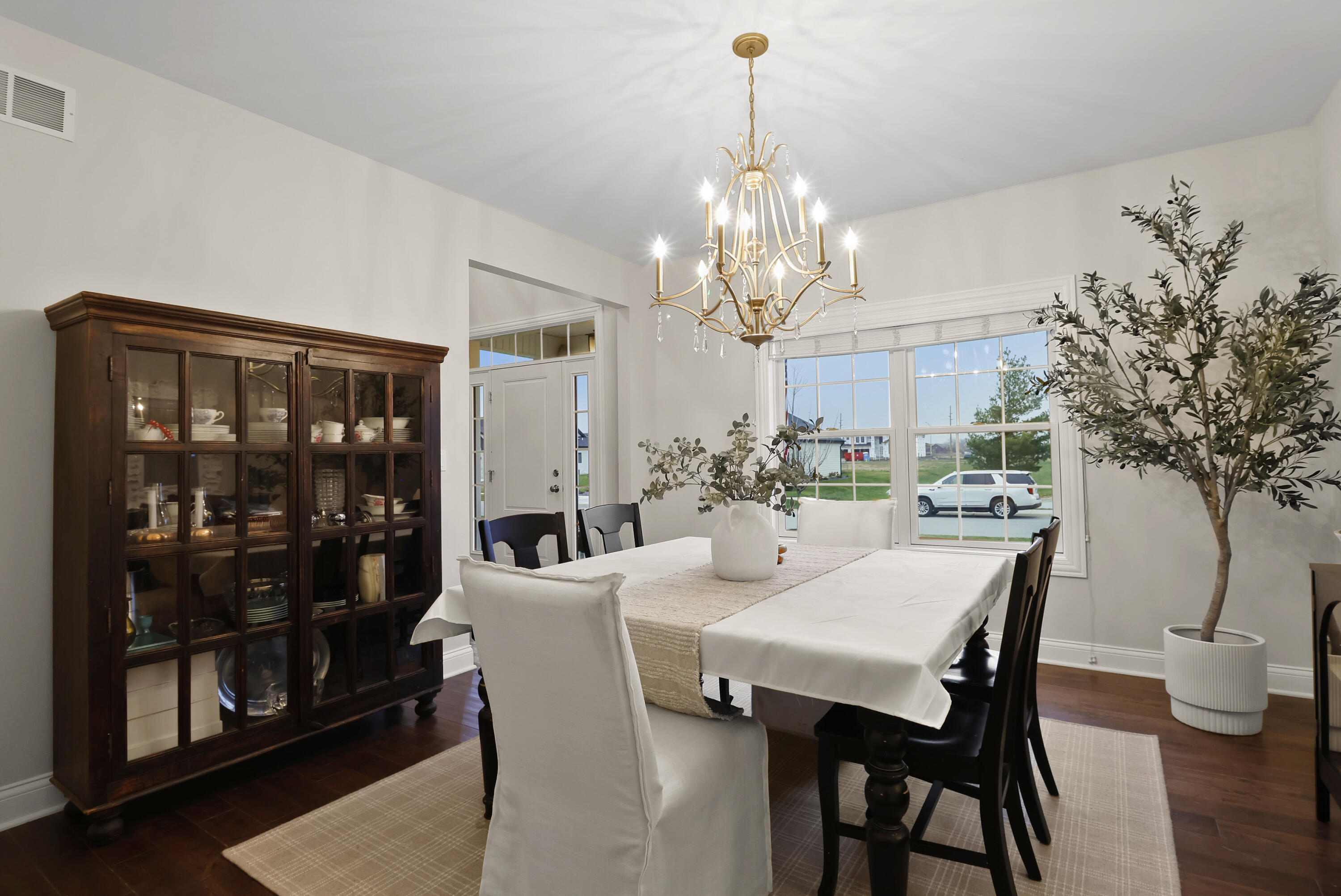 10230 Barbara Lane Munster, IN 46321 - Photo 15 of 47 a view of a dining room with furniture and chandelier