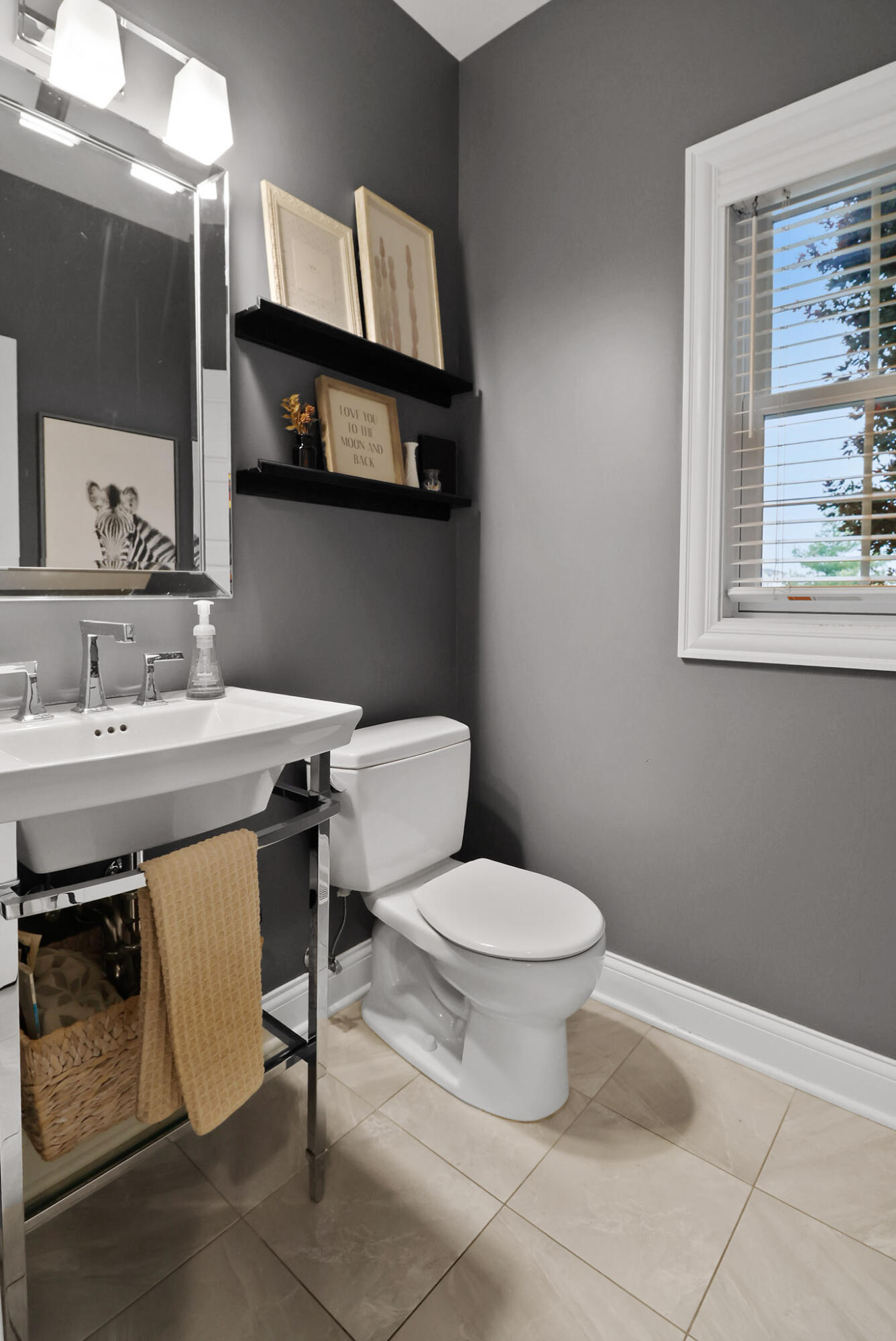 10230 Barbara Lane Munster, IN 46321 - Photo 20 of 47 a bathroom with a sink a toilet a mirror and vanity