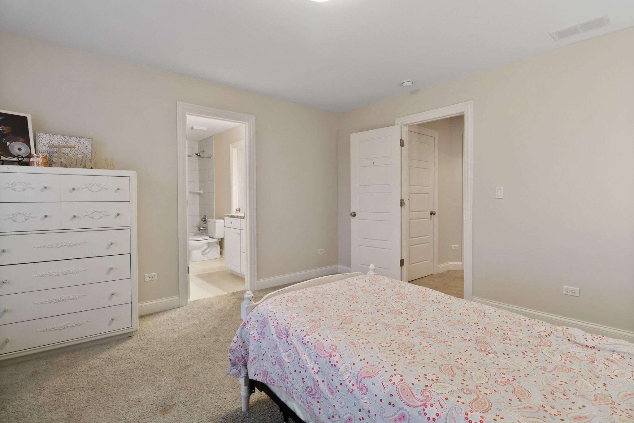 10230 Barbara Lane Munster, IN 46321 - Photo 35 of 47 a bedroom with a bed and a dresser