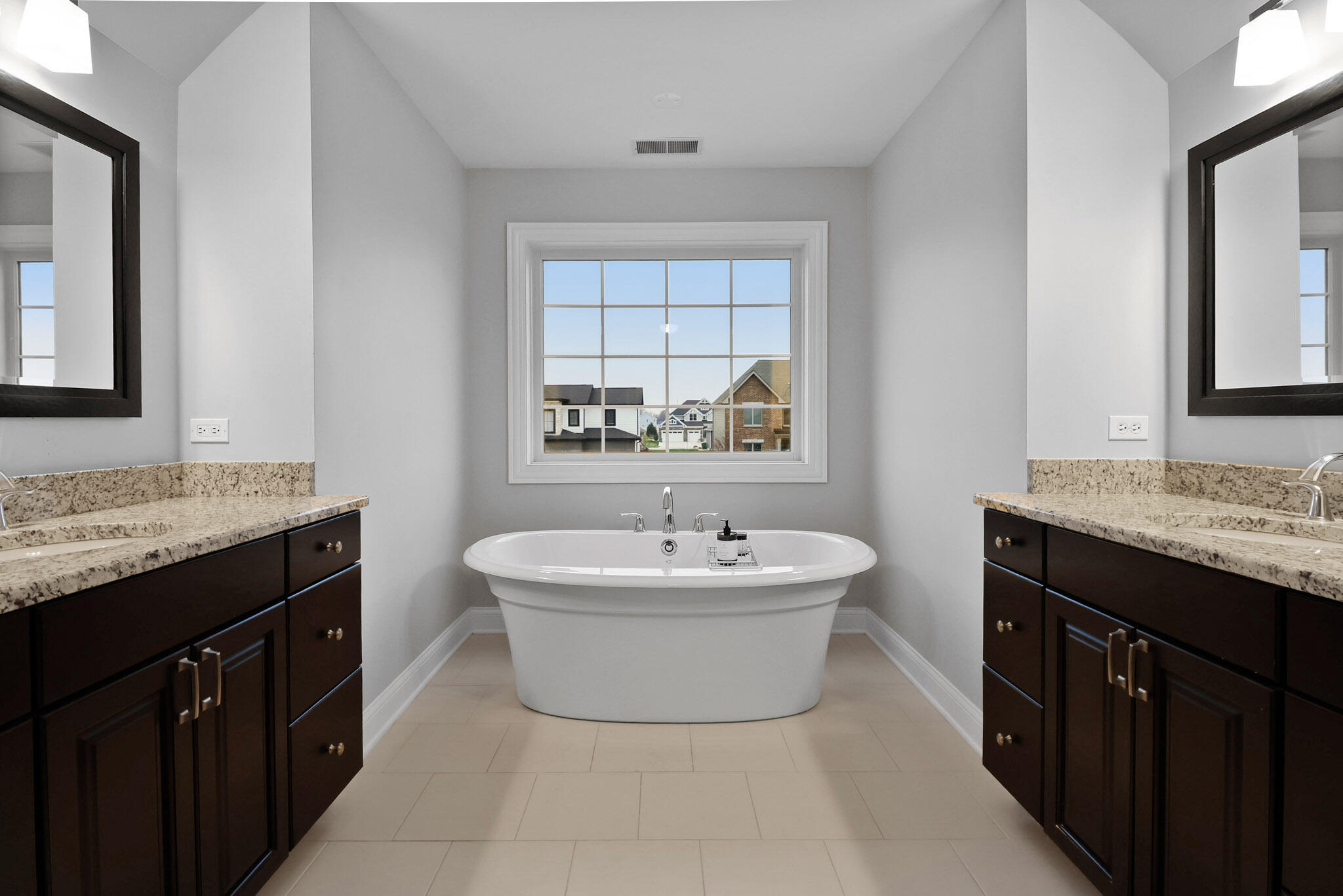 10230 Barbara Lane Munster, IN 46321 - Photo 38 of 47 a bath room with a sink mirror and a bathtub