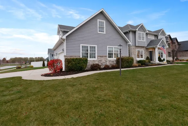 a view of a house and a yard