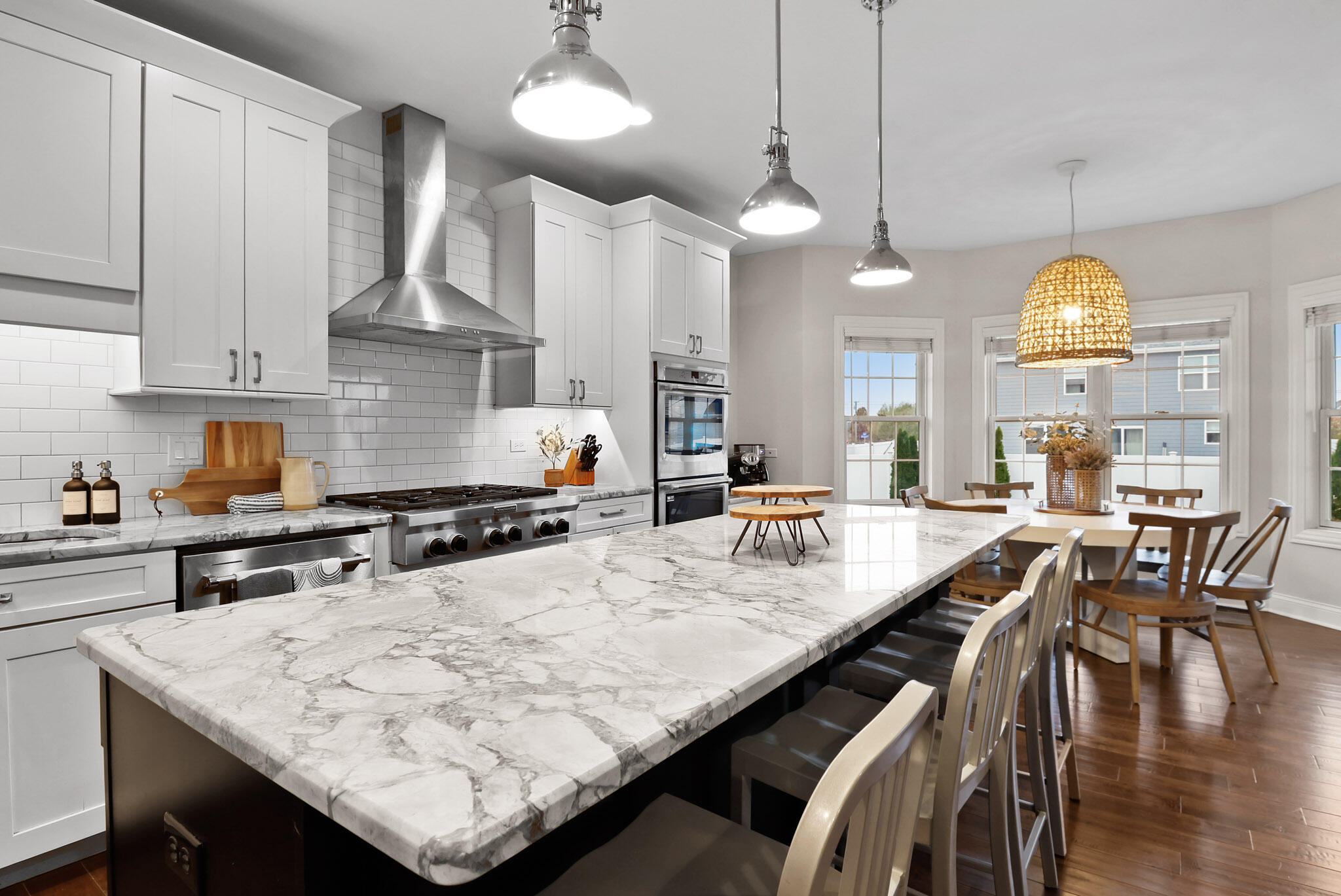 10230 Barbara Lane Munster, IN 46321 - Photo 9 of 47 a kitchen with stainless steel appliances granite countertop a stove a refrigerator a kitchen island a sink and chairs