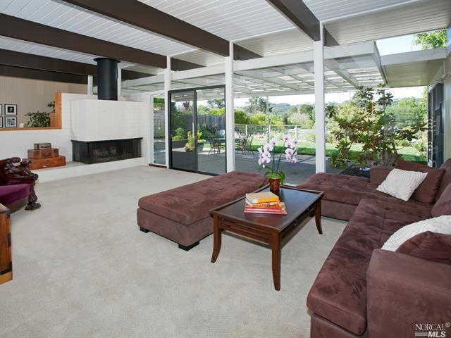 623 Las Colindas Road San Rafael, CA 94903 - Photo 1 of 1 a living room with furniture a flat screen tv and a floor to ceiling window