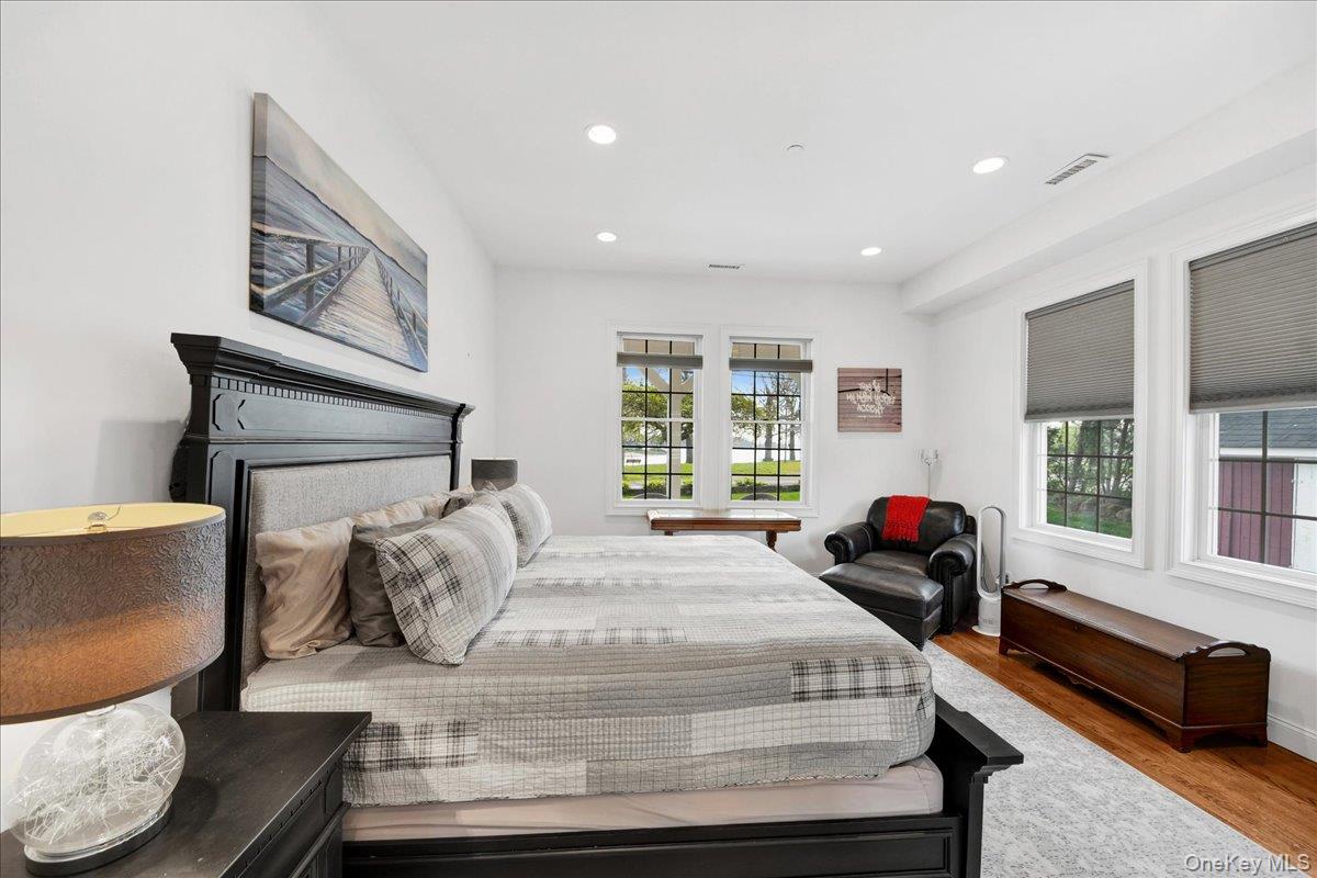 2 Harbor Lane, Unit 102 New Rochelle, NY 10805 - Photo 13 of 30 The bedroom features hardwood flooring, recessed lighting, and windows with horizontal blinds