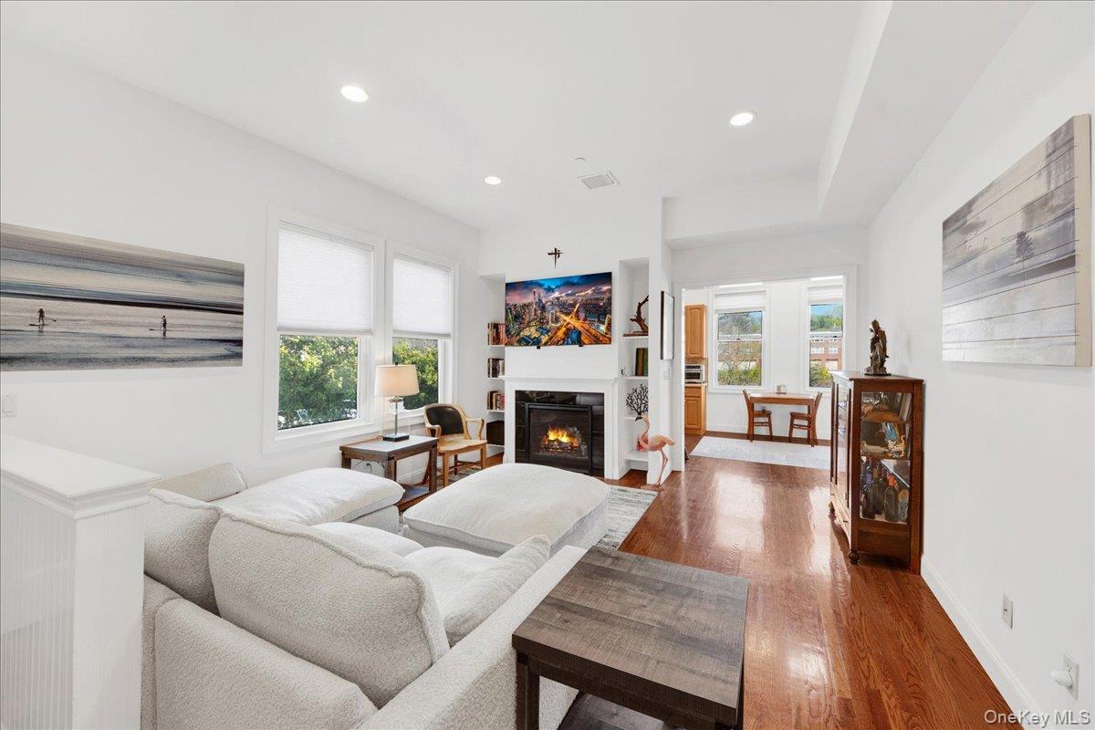 2 Harbor Lane, Unit 102 New Rochelle, NY 10805 - Photo 5 of 30 Inviting living area featuring hardwood floors, recessed lighting, and a fireplace