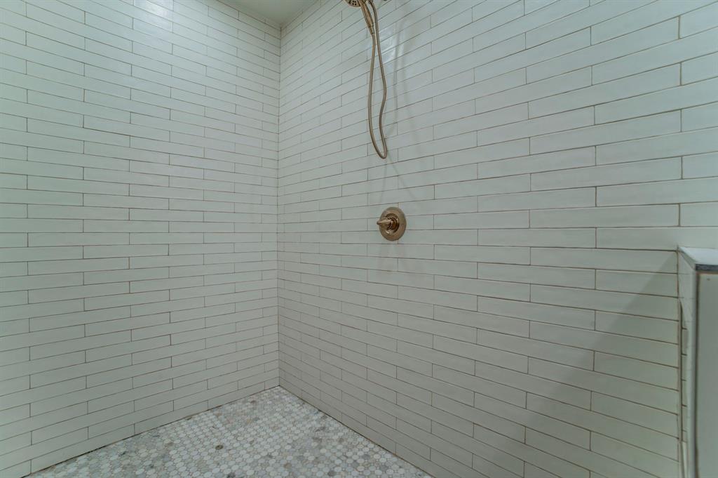5914 Victor Street Dallas, TX 75214 - Photo 16 of 32 a bathroom with a shower