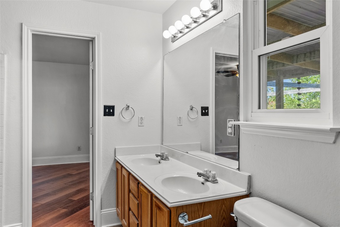 212 Valley Run Trail Elgin, TX 78621 - Photo 12 of 31 a bathroom with a sink toilet and shower