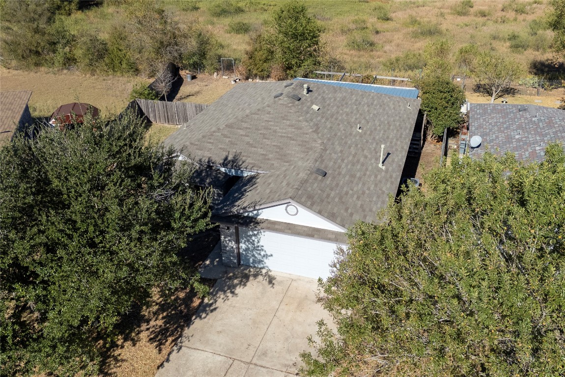 212 Valley Run Trail Elgin, TX 78621 - Photo 19 of 31 a view of a lake with a building in the background