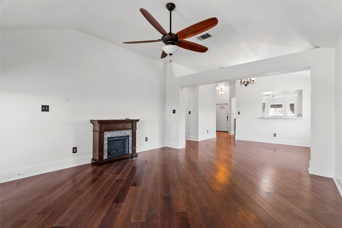 212 Valley Run Trail Elgin, TX 78621 - Photo 2 of 31 a view of empty room with wooden floor and ceiling fan