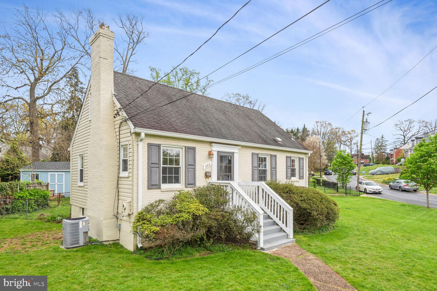804 Dryden Street Silver Spring, MD 20901 - Photo 25 of 33 a view of a house with a yard chairs and table