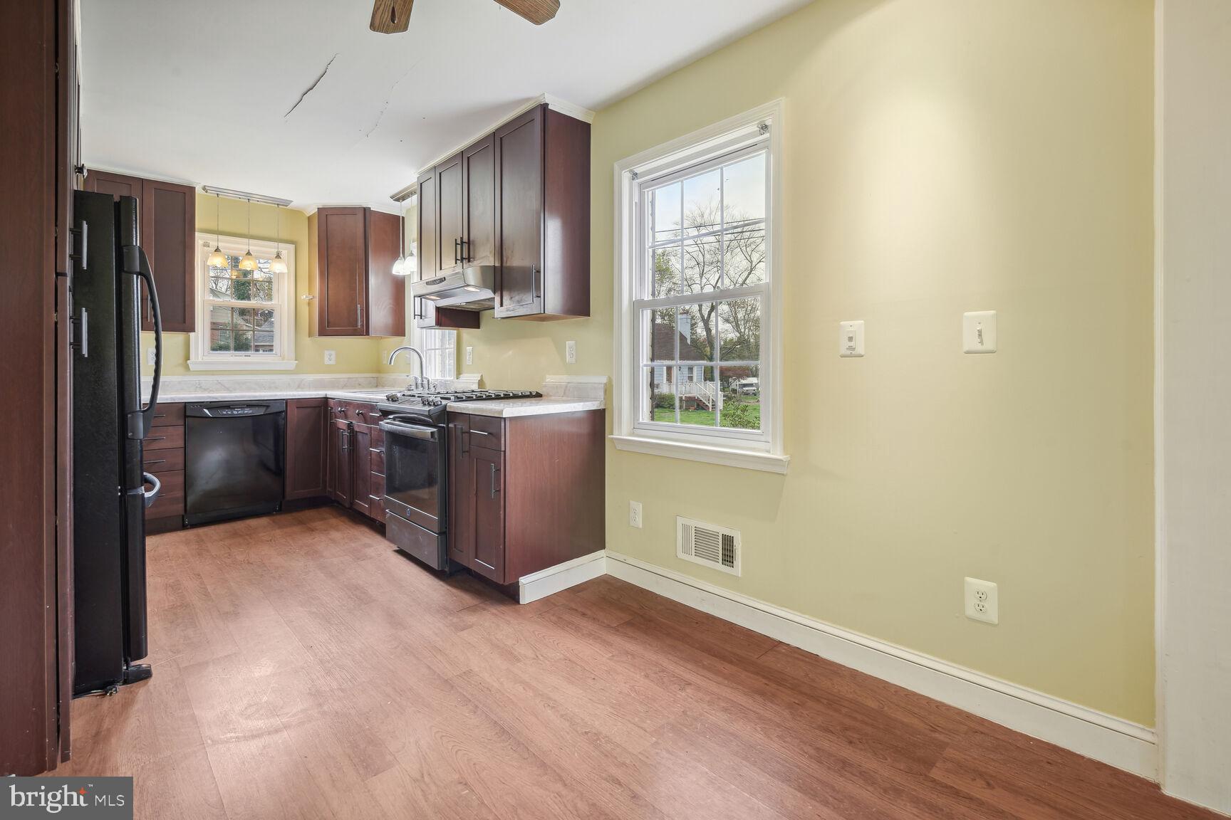804 Dryden Street Silver Spring, MD 20901 - Photo 5 of 33 a room with stainless steel appliances granite countertop a stove a sink and a refrigerator