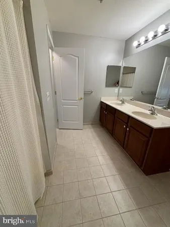 a room with a cabinets and a sink