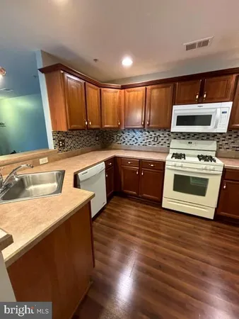 a kitchen with a stove and a microwave
