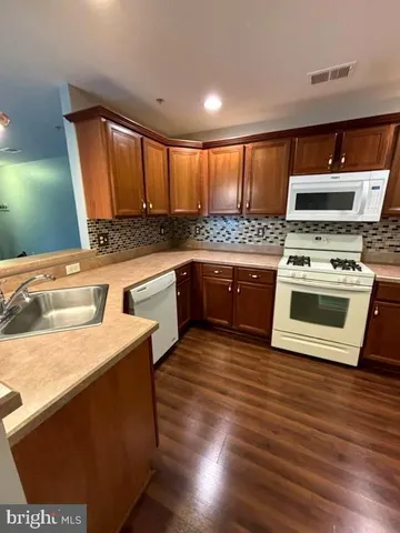 a kitchen with a stove and a microwave