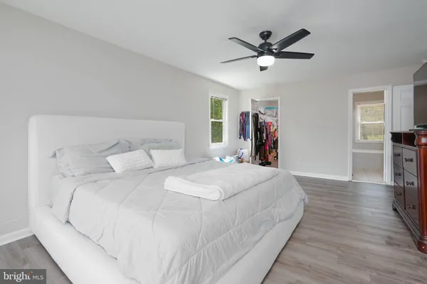 a large white bed in a white room