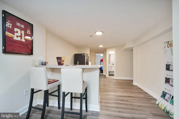 a view of a dining room with furniture and wooden floor