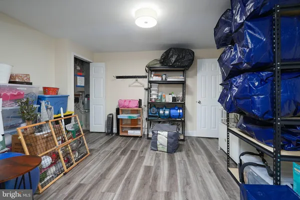 a view of a room with wooden floor and furniture
