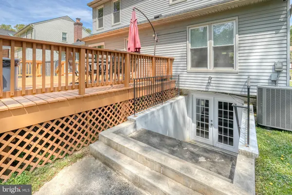 a view of a balcony with wooden fence