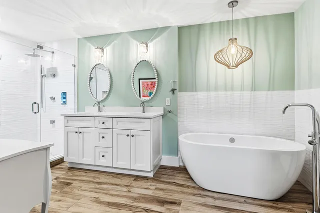 a bathroom with a double vanity sink mirror and toilet